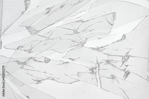 Broken pieces of glass on white background