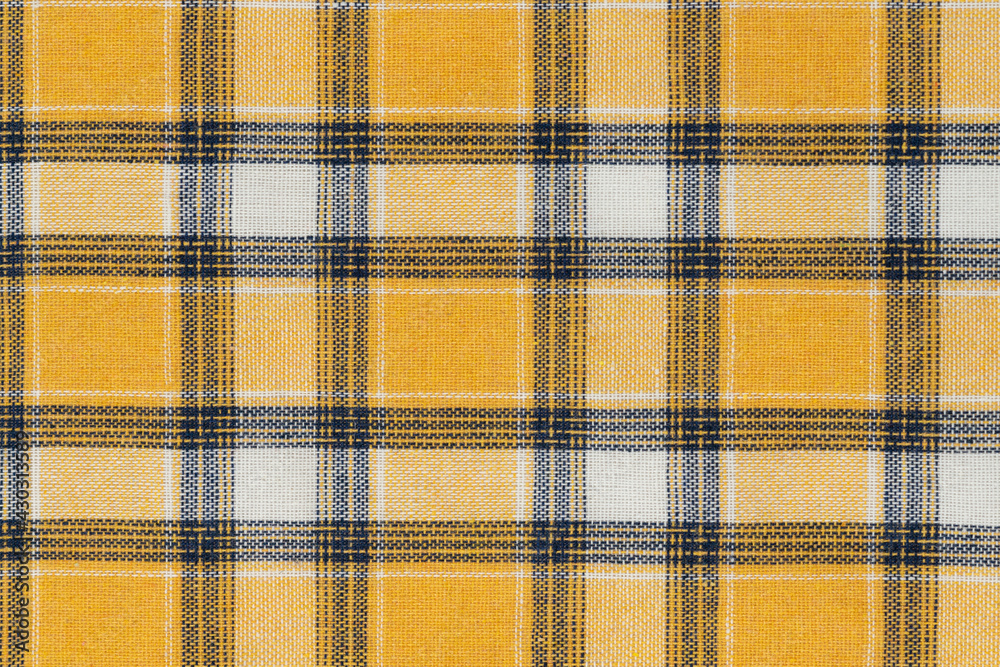 Yellow white tartan texture background. shirt fabric with a checkered pattern. factory material Yellow white tartan texture background. shirt fabric with a checkered pattern. factory material