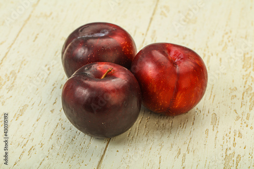 Ripe sweet plum fruit heap