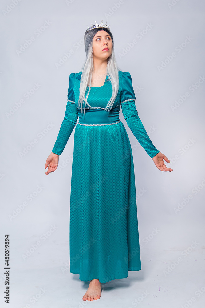 Full length portrait of a princess in a medieval, fantasy, turquoise dress with ash hair and a silver crown, posing isolated on a white background.
Full length portrait of a princess in a medieval, fantasy, turquoise dress with ash hair and a silver crown, posing isolated on a white background.