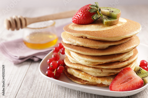 pile of pancakes and berries fruits