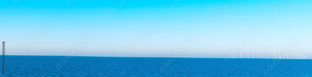 Light blue sky, deep blue sea, wind power energy