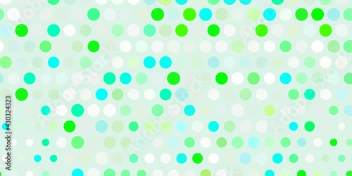 Light green vector pattern with spheres.