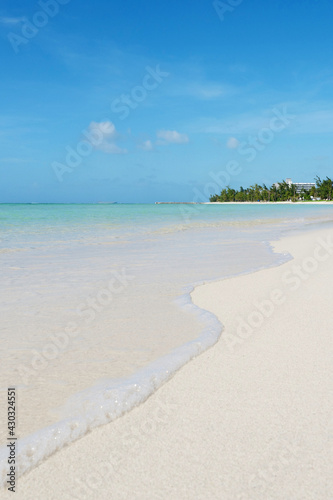 The sea under the blue sky and white clouds, the beautiful beach