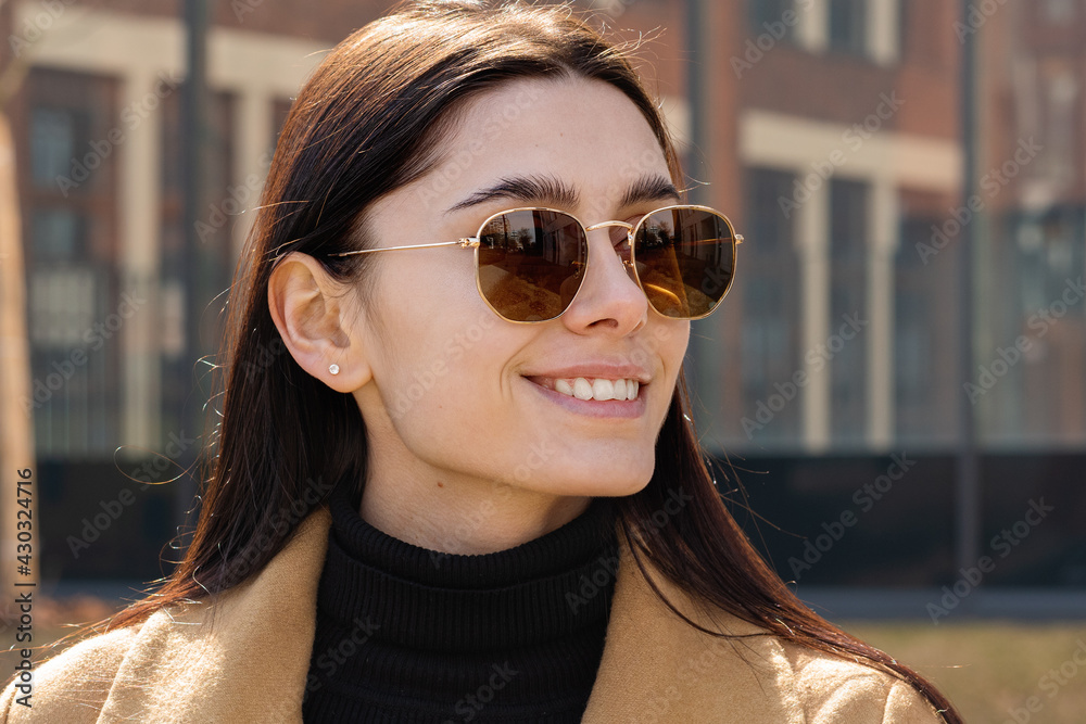 Close-up of the face of a beautiful young woman in sunglasses outdoors Close-up of the face of a beautiful young woman in sunglasses outdoors