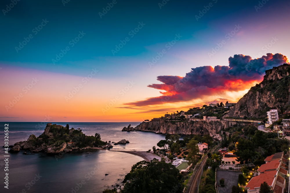 Fire sky over the bay of Isola Bella Nature Reserve, Taormina, Sicily 
