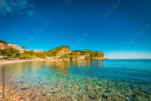 Turquoise water on the beach of Taormina, Sicily 