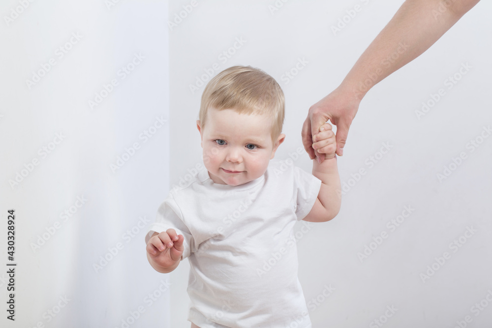 baby takes first steps holding mom's hand baby takes first steps holding mom's hand