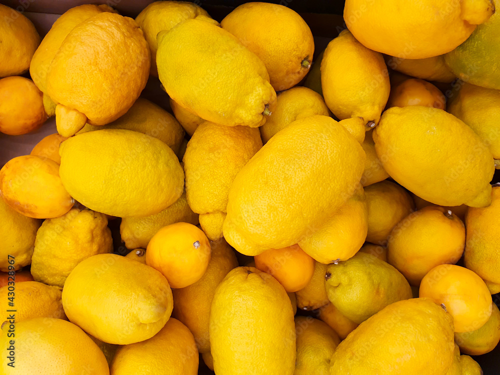 Fresh lemons a lot. Natural farm products, eco market. Lemons pattern. Top view.