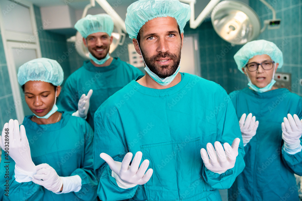 Portrait of a successful medical surgeon team inside operating room Portrait of a successful medical surgeon team inside operating room