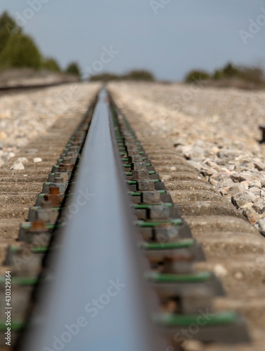 railroad tracks in a field