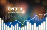 Financial technology fintech word on uptrend growth graph with double exposure. Investment trading in bull narket and saving concept