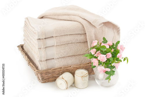 Bath towels in a wicker basket.