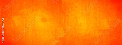 Dark orange yellow autumn colored painted abstract stone concrete paper texture background panorama banner