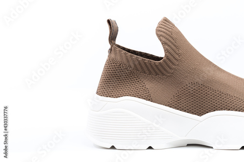 modern beige sneakers with white soles isolated on white background - Image