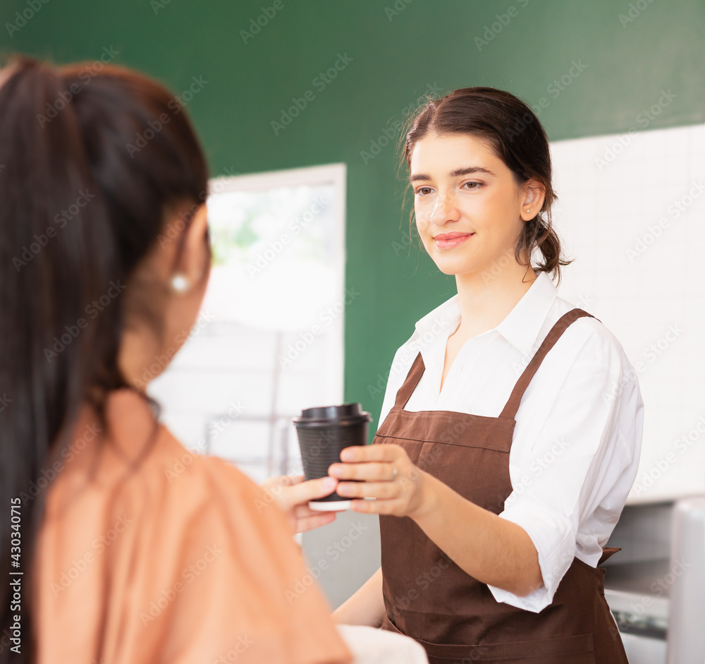Square frame of beautiful caucasian barista woman give takeaway coffee cup to customer and customer receiving coffee cup. Square frame of beautiful caucasian barista woman give takeaway coffee cup to customer and customer receiving coffee cup.