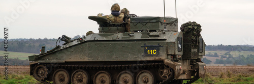 british army FV103 Spartan light infantry fighting vehicle tank on maneuvers on Salisbury Plain, Wiltshire