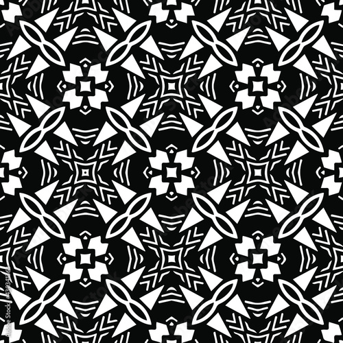 Geometric vector pattern with triangular elements. Seamless abstract ornament for wallpapers and backgrounds. Black and white colors. © t2k4