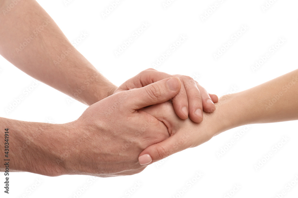 Man and woman holding hands on white background, closeup Man and woman holding hands on white background, closeup