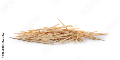 Heap of wooden toothpicks on white background photo