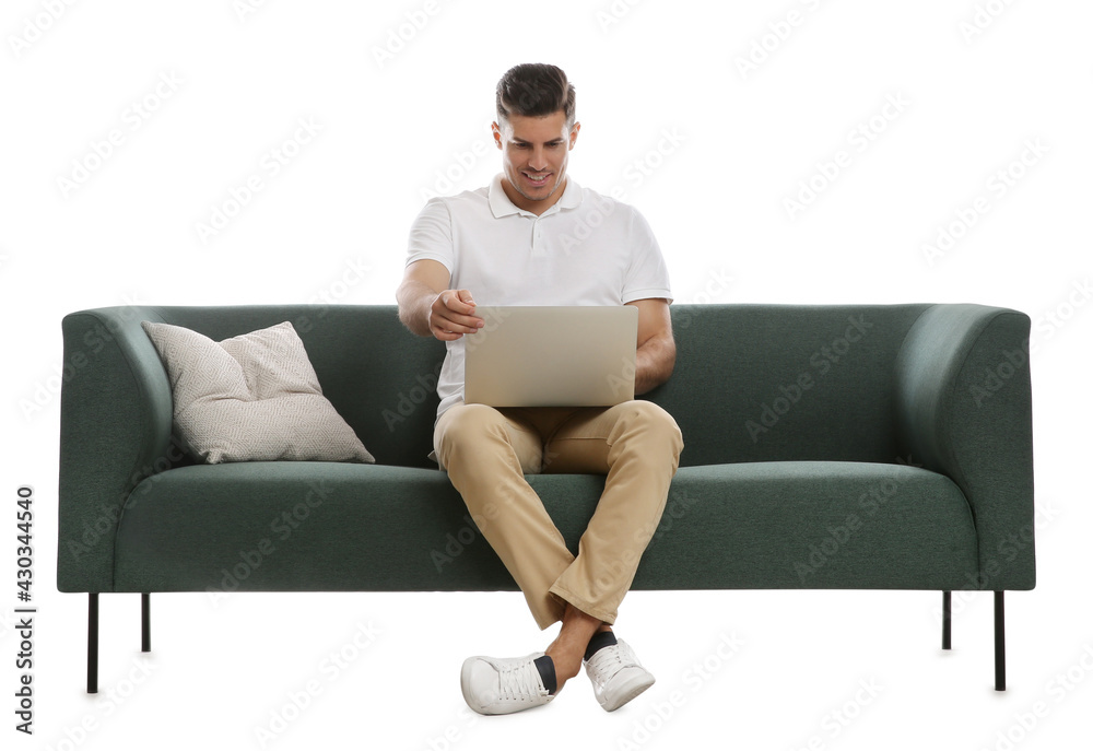 Man with laptop on comfortable green sofa against white background Man with laptop on comfortable green sofa against white background