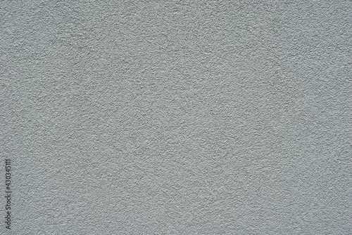 Plaster on a gray wall. Concrete wall texture close up.