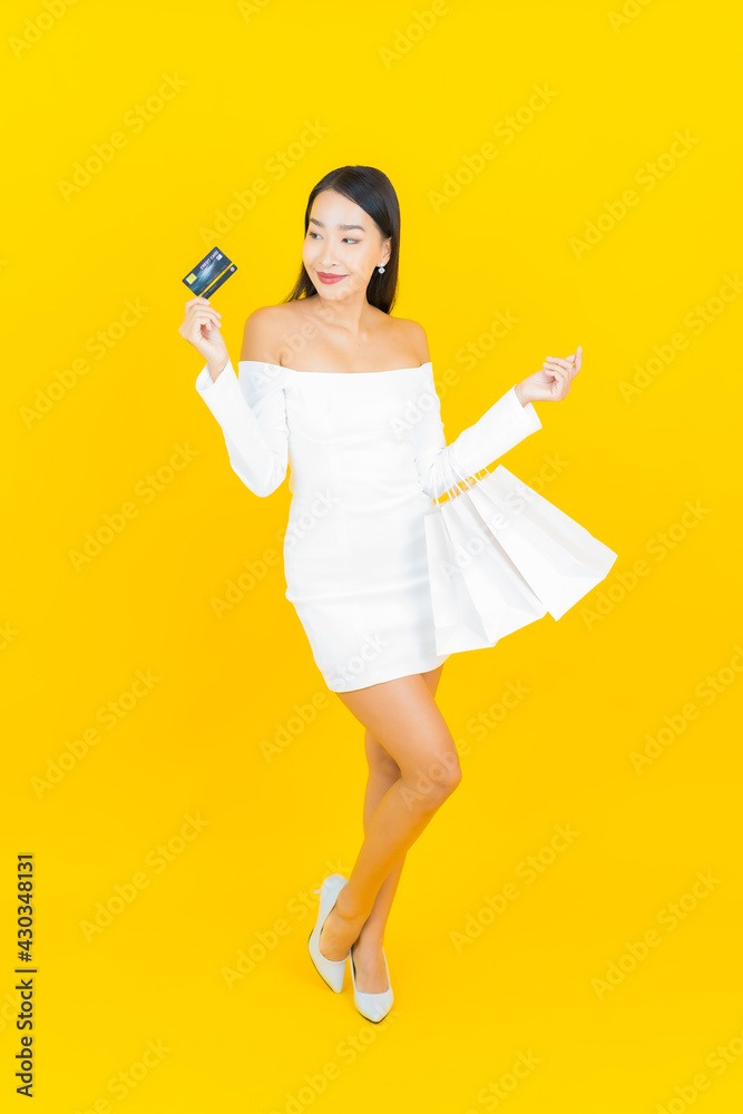 Portrait beautiful young business asian woman with shopping bag from department store and mall Portrait beautiful young business asian woman with shopping bag from department store and mall