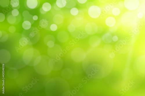 Green and white bokeh background from nature.
Bright glowing green nature background in the form of bokeh.