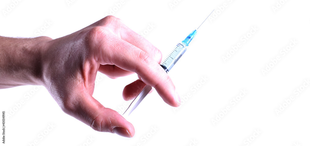 Syringe with covid-19 vaccine in hand with place for text
Syringe with covid-19 vaccine in hand with place for text