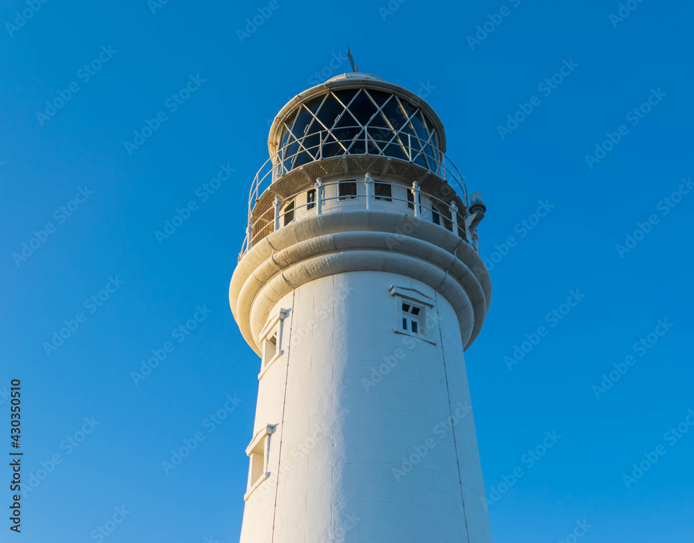 Lighthouse on blue sky