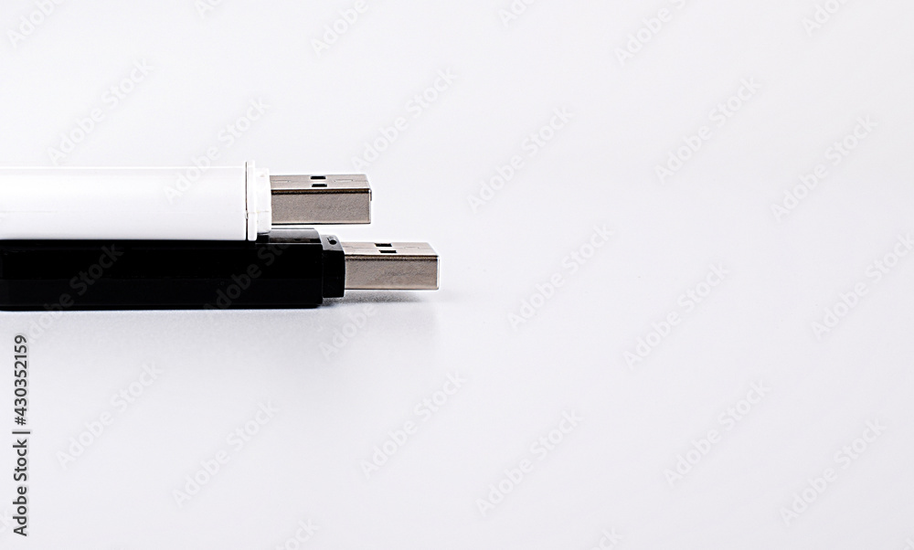 Two USB drives on a light background. Copy space. Two USB drives on a light background. Copy space.