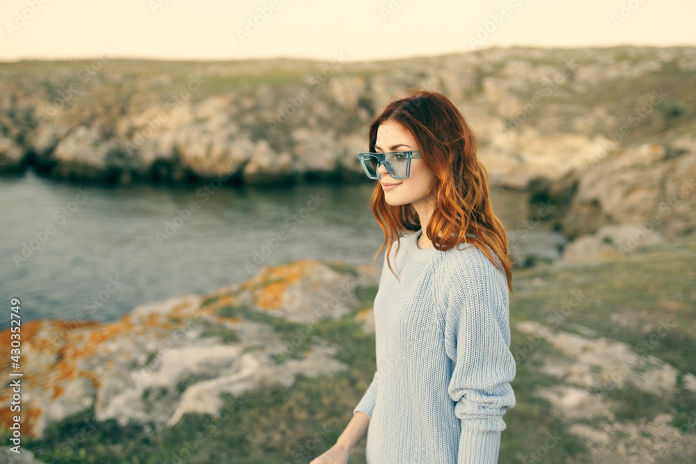 attractive woman with glasses on nature and rocky mountains landscape luxury attractive woman with glasses on nature and rocky mountains landscape luxury