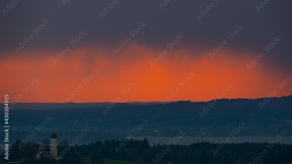 burning sky at sunset with thick and dark clouds burning sky at sunset with thick and dark clouds