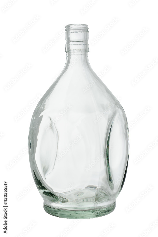 Beautifully shaped empty glass bottle for whiskey and brandy. Isolated on a white background, close-up Beautifully shaped empty glass bottle for whiskey and brandy. Isolated on a white background, close-up