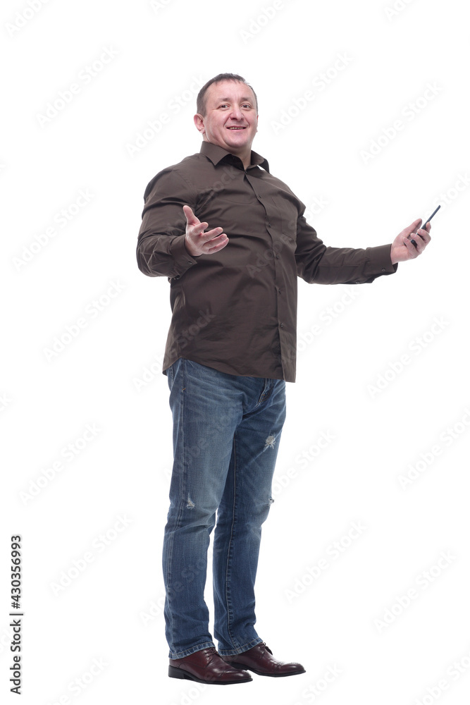 friendly mature man with a smartphone looking at you . friendly mature man with a smartphone looking at you .