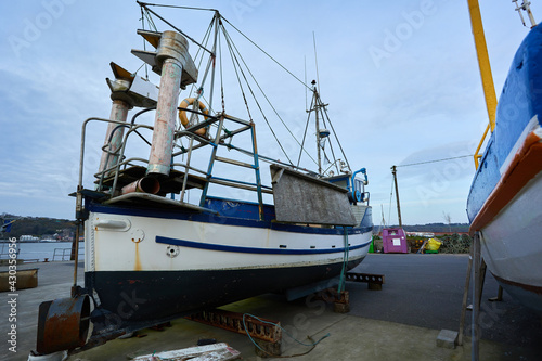 Fishing boat at the harbor © JORGE CORCUERA