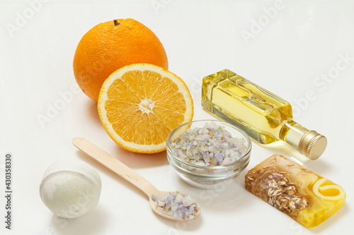 Cut orange with whole one, bottle with aromatherapy oil and sea salt
