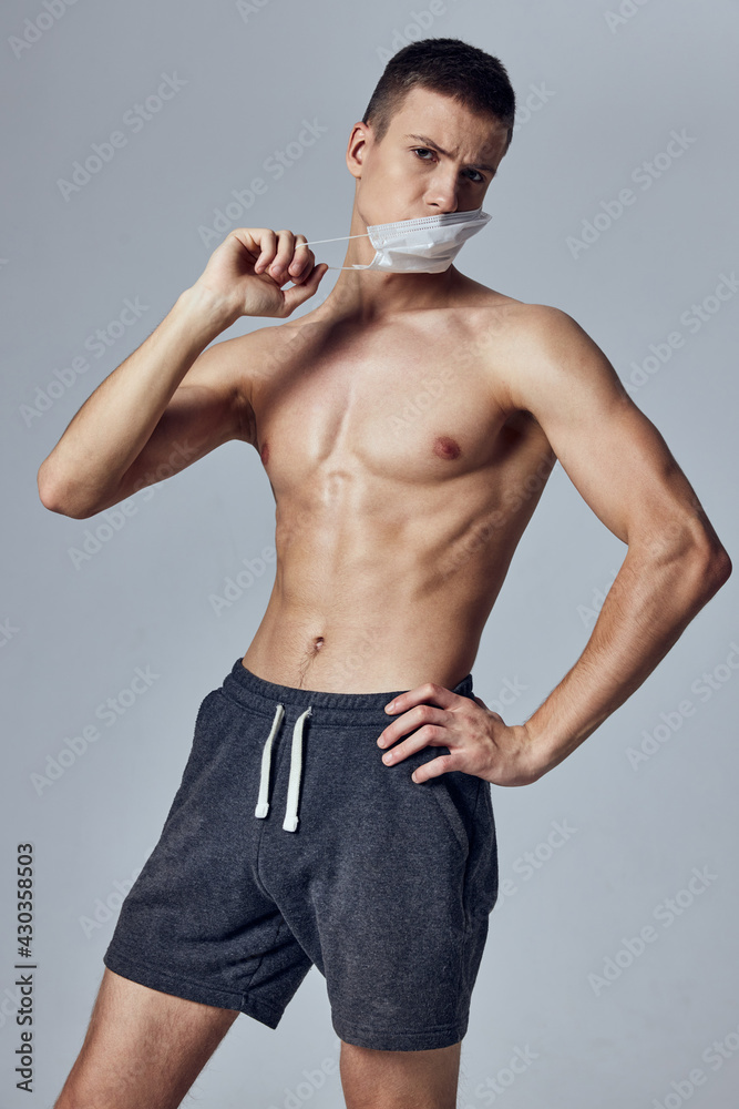 sports man with naked torso bodybuilder workout medical mask protection sports man with naked torso bodybuilder workout medical mask protection
