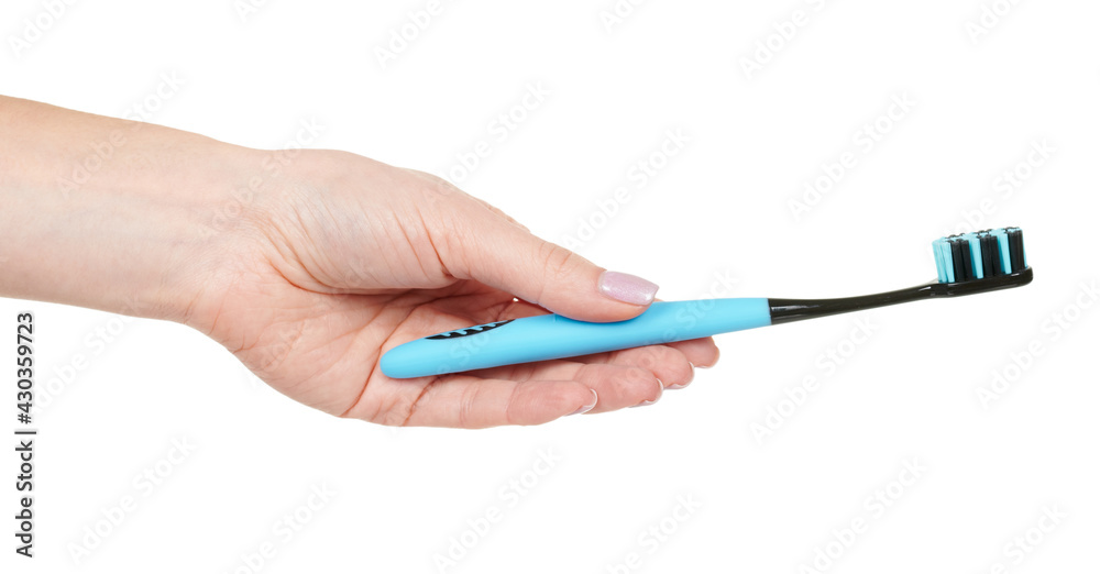 Hand with blue dental toothbrush isolated on white background Hand with blue dental toothbrush isolated on white background