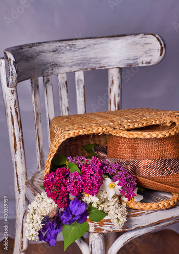 Stillife with lilak flowers and hat on vintaje cher photo