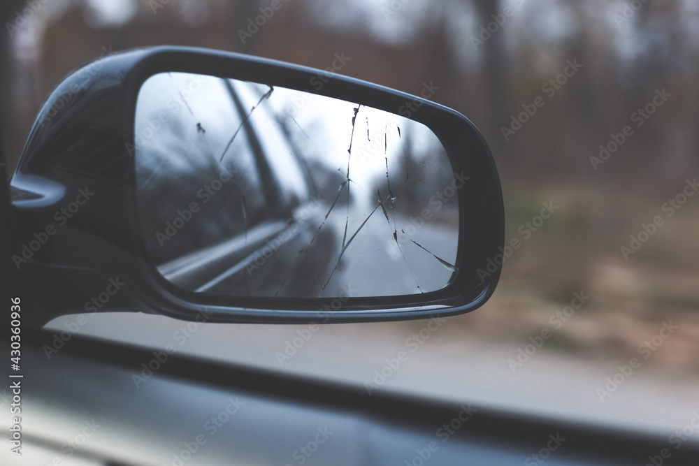 View of the broken side mirror of the car