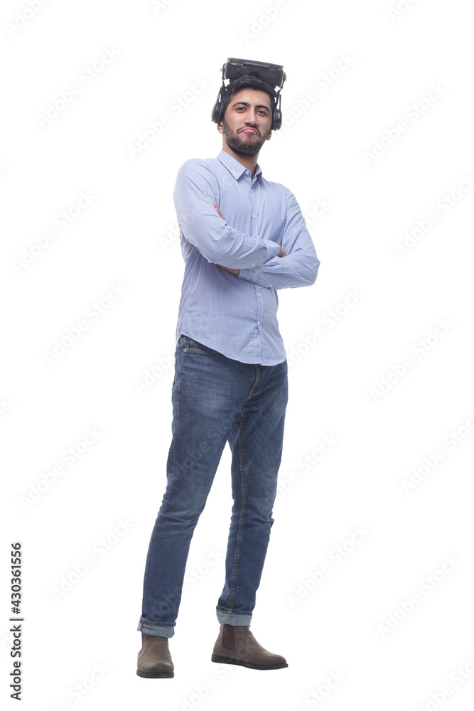 in full growth. confident young man in virtual reality glasses. in full growth. confident young man in virtual reality glasses.