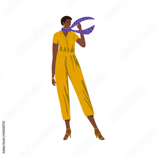 Afro american short-haired girl standing in fashionable modern jumpsuit with neckerchief isolated on white background