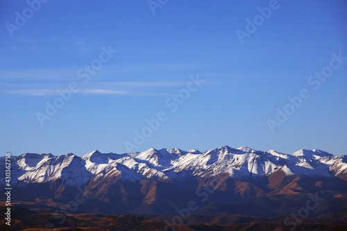 Mountains with Snow-Capped Peaks. The Concept Of Travel And Tourism. Background
