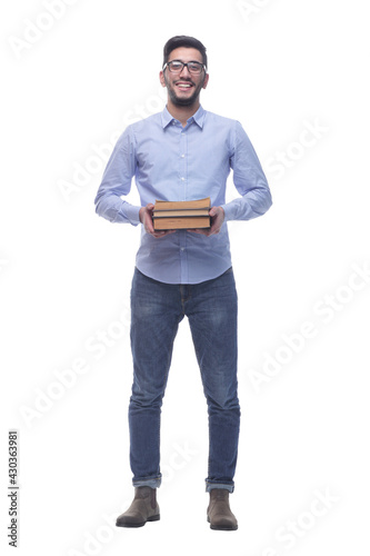 young man with glasses and a stack of books.