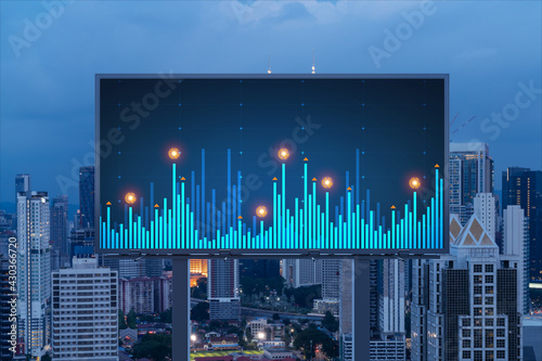Photography FOREX graph hologram on billboard, aerial night panoramic cityscape of Kuala Lumpur