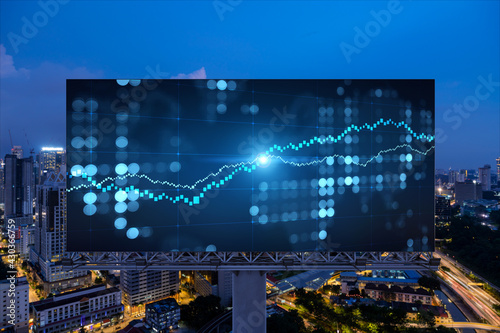 Canvas Print FOREX graph hologram on billboard, aerial night panoramic cityscape of Kuala Lumpur