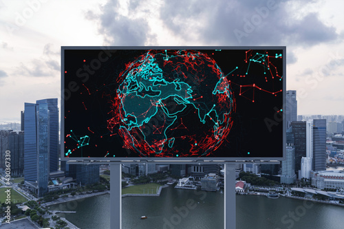 Hologram of Earth planet map on billboard over sunset panoramic cityscape of Singapore. The concept of international companies in Southeast Asia.