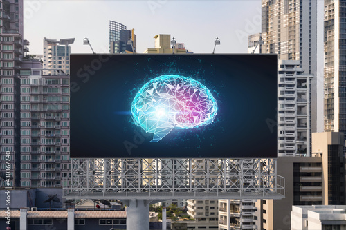 Brain hologram on billboard with Bangkok cityscape background at day time. Street advertising poster. Front view. The largest science hub in Southeast Asia. Coding and high-tech science.