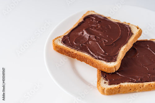 toasts with chocolate butter on a white acrylic background